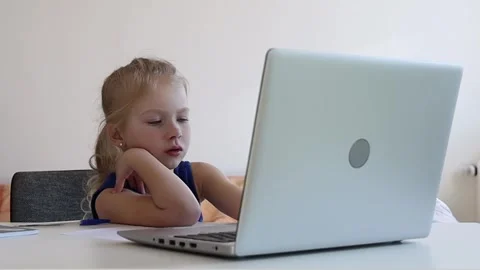 Girl watching video on the computer. Video stock 244008063