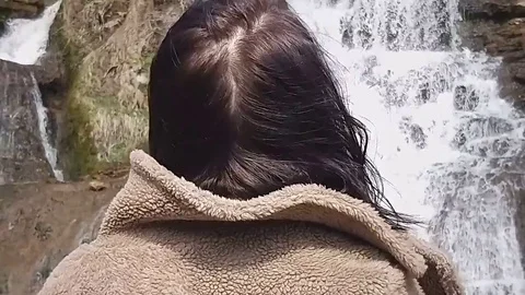Girl waterfall Stock Footage
