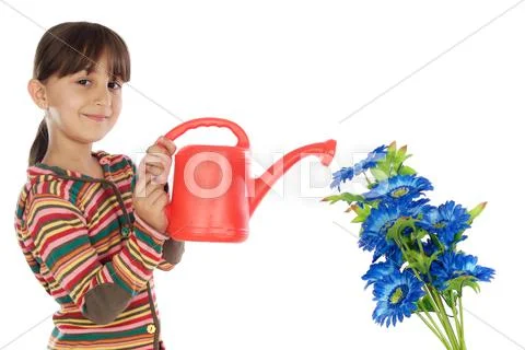 Girl watering flowers Stock Photos