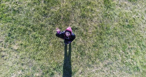 A girl waves goodbye Video stock 128650411