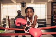Girl Wearing Boxing Gloves Standing Near A Boxing Ring Stock Photos