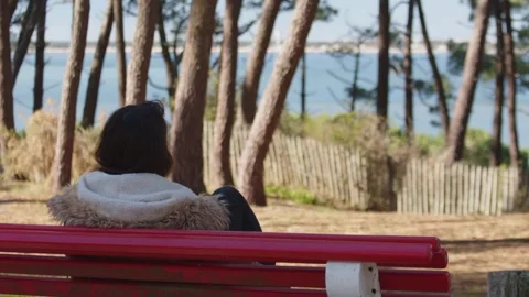 Girl Wearing Fur Coat Sit On The Bench A 