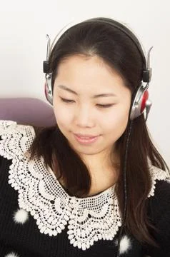 Girl wearing headphones Stock Photos