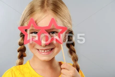 Girl wearing star shaped glasses Stock Photos