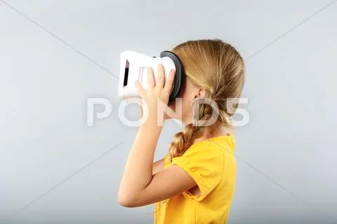 Girl wearing virtual reality headset Stock Photos