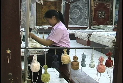 Girl weaving carpel Stock Footage