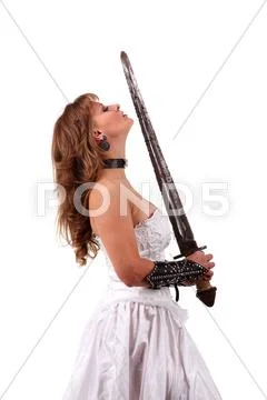 Girl in a wedding dress with a sword on the white background Stock Photos