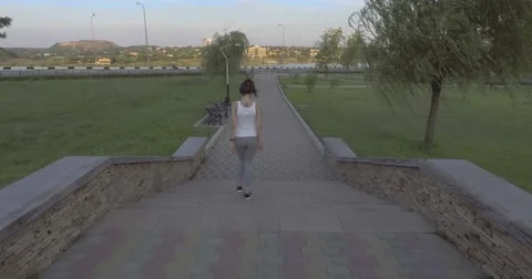 A girl while jogging in park Stock Footage 66504614