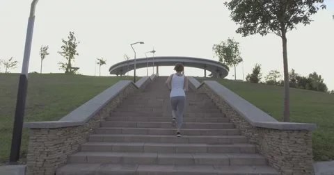 A girl while jogging in park Stock Footage 66504892