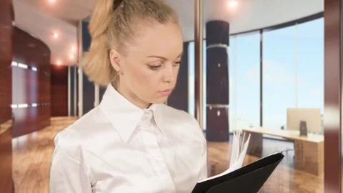 Girl in white blouse posing with documents in the business centre Stock Footage 78363534