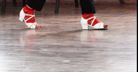 Girl in white dancing shoes practicing steps on the floor Stock Footage 280112410