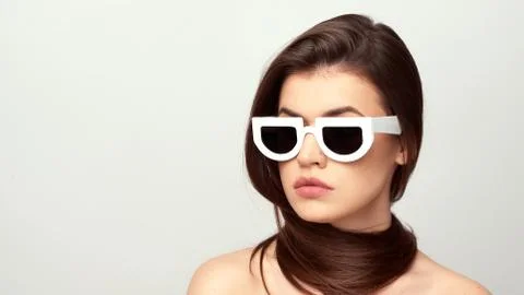 Girl in white glasses Stock Photos