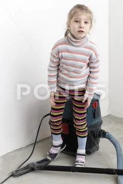 Girl with white hair. removes the house after a major overhaul. in the hands Stock Photos