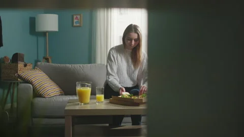 Girl in a white jacket eats pizza Stock Footage 138222447