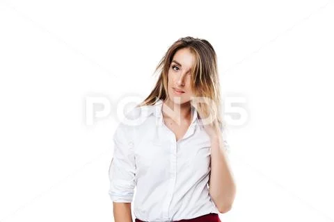 Girl in white shirt and burgundy skirt on an isolated white background Stock Photos