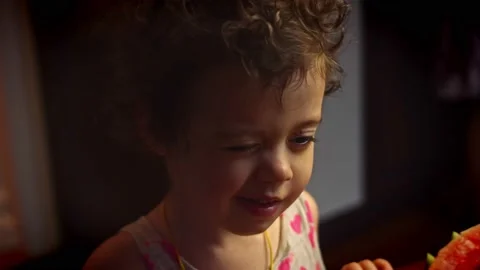 The girl who recently slept receives a watermelon as a gift. 4k video Stock Footage 157443864