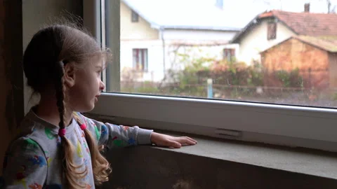 Girl by the window Stock Footage 142603075