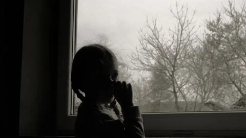 Girl by the window Stock Footage 142603084