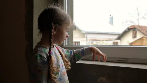 Girl by the window Stock Footage 142603501