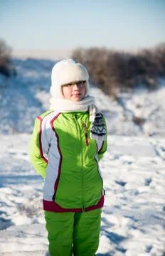 Girl in winter bright clothes with glasses Stock Photos