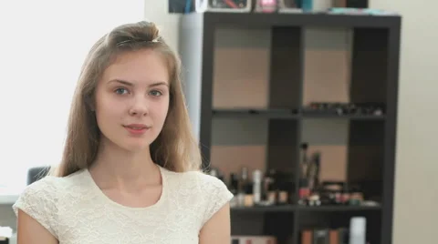 Girl without make up blinks one eye on the camera 스톡 동영상 64890358