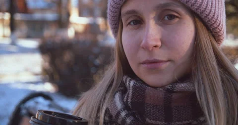 A girl without makeup in winter looking at the camera very close-up Stock Footage 143416616