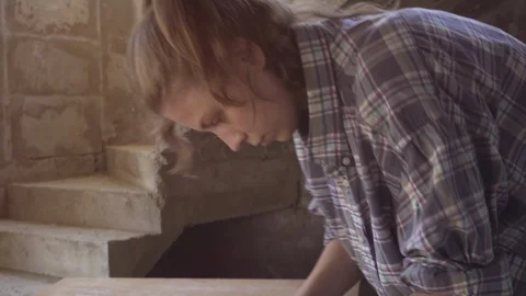 The girl at work in a carpentry workshop, with a hand planer. Close-up Stock Footage 103623975