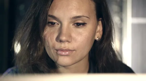 Girl working on computer in the evening in the interior with water background Stock Footage 42049484