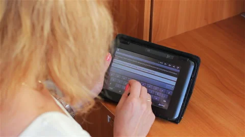 The girl working with e-book Video stock 58799628