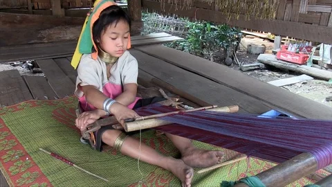 Girl working on a handloom Stock Footage 103452082