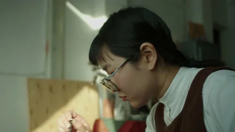 Girl working in her workshop pottery studio 動画素材 234877101