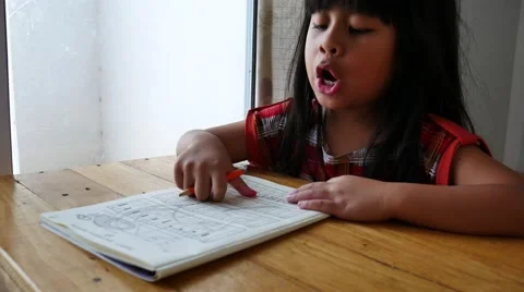 Girl working on math worksheet 4k 스톡 동영상 55859033