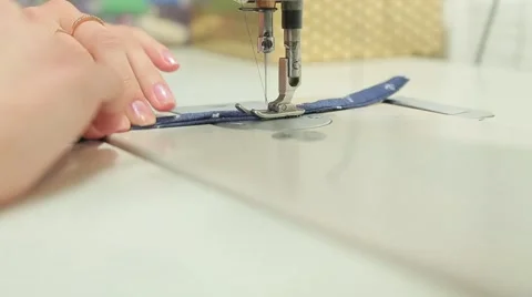 Girl working at the sewing machine Stock Footage 59710709