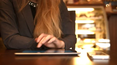 Girl working with tablet computer in cafe Stock Footage 63048788