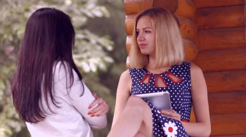 Girl working on a tablet computer in the park Video stock 51936291