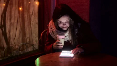 Girl working on tablet drinking tea Stock Footage 71585067