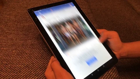 Girl working on a tablet Stockbeeldmateriaal 90938069