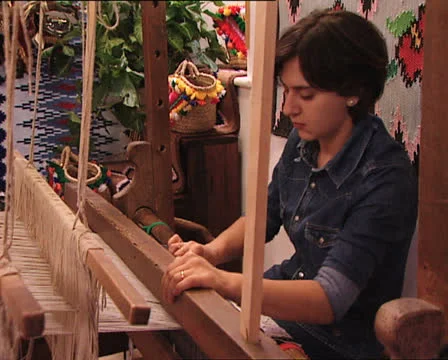 Girl working at traditional loom 4 Stock Footage 24759953