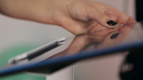 The girl works with a tablet touchscreen Stock Footage 70614210