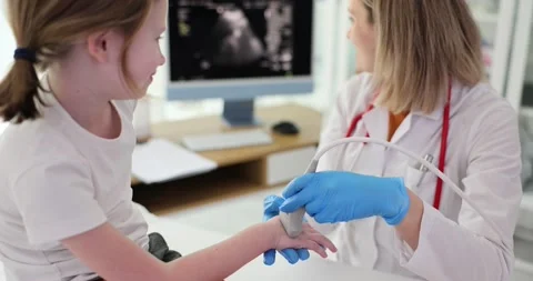Girl wrist was diagnosed using ultrasound concept Stock Footage 239468046