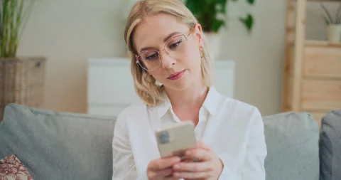 Girl Writes Message on Smartphone Stock Footage 276167613