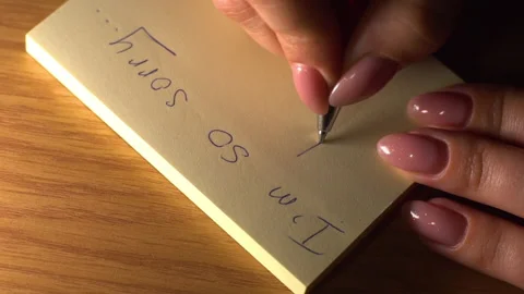 Girl writes a note Stock Footage 137658664