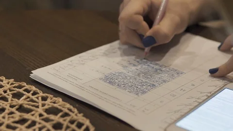 The girl writes in the notebook a close-up note Stock Footage 113213954