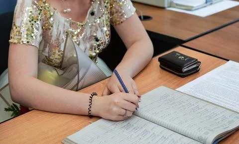 The girl writes in a notebook Stock Photos