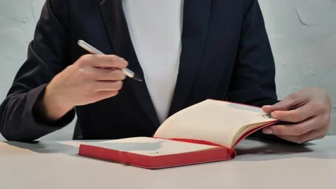 The girl writes notes and a to-do list for the week in a workbook 스톡 동영상 149922247