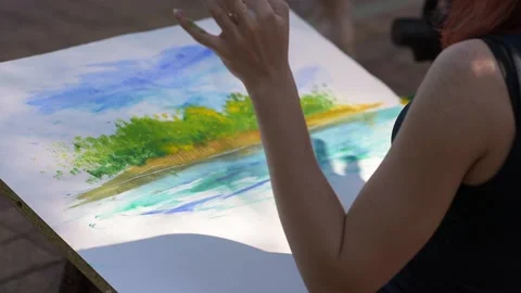 The girl writes a picture with her fingertips Stock Footage 130641253