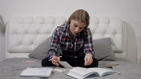 Girl writes a summary Stock Footage 103376832
