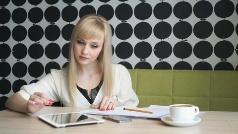 Girl writes text on paper sheets Stock Footage 71384162