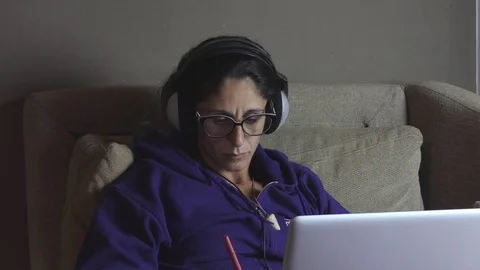 Girl writes while studying on laptop Stock-Footage 119694015