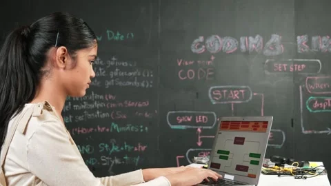 Girl writing code or engineering prompt while attend in STEM class. Edification Stock Footage 273667942